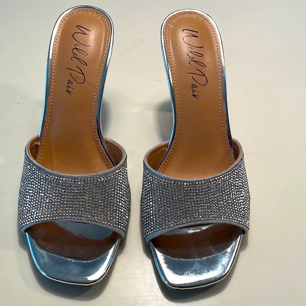 Brand New!!   Silver sandals/heels with rinestones.